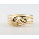 A 9ct yellow gold diamond set snake ring size V, 10 gramsOne stone is missing