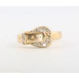 A 14ct yellow gold diamond set buckle ring, 3.9 grams, size K 1/2