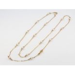 An 18ct yellow gold seed pearl set necklace 64cm, 5.4 grams