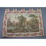 A machine made tapestry panel depicting bridge and river 89cm x 124cm