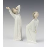 A Lladro figure of a yawning boy wearing a nightshirt, impressed C-14 20cm and 1 other crouching