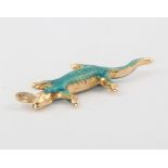 A 14ct yellow gold enamelled lizard pendant 1.4 grams There is bruising to the enamel