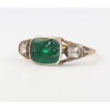 A 9ct yellow gold emerald and paste ring, size K, 2.9 gramsThe centre stone is chipped