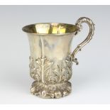 A Victorian embossed silver christening tankard with acanthus leaf decoration, London 1852, 125