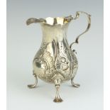 A George III embossed silver cream jug London 1762, 99 grams
