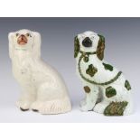 A 19th Century Staffordshire figure of a seated spaniel with separately moulded front leg 23cm and 1