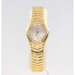 A lady's 18ct yellow gold diamond set Ebel wristwatch on an articulated bracelet numbered
