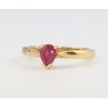 An 18ct yellow gold pear cut ruby ring, size O, 3.8 grams