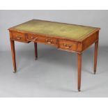 A 19th Century mahogany writing table with green inset tooled leather writing surface above 1 long