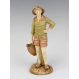 A Victorian Royal Worcester porcelain figure of a standing fisherman with basket, the base with