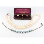 A string of cultured pearls with a silver clasp 42 cm, together with 3 18ct gold studs 2 grams and a