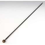 An ebony walking cane with silver band and "tigers eye" terminal