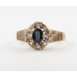 A 9ct yellow gold sapphire and diamond cluster ring, size P, 3.3 grams