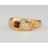 An 18ct yellow gold ruby and diamond ring size Q, 4.1 grams