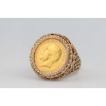 A half sovereign ring in a 9ct yellow gold mount, the mount 3 grams Please note the description