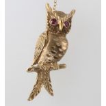 A 9ct yellow gold gem set owl brooch 6.9 grams