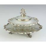A circular cut glass and sterling silver butter dish and cover raised on 3 claw supports, 224 grams,