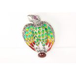 A silver eagle brooch with enamelled marcasite and cabochon ruby decoration