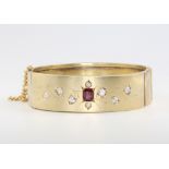 A 15ct yellow gold ruby and diamond bangle, 25.1 grams