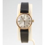 A lady's 9ct yellow gold Omega wristwatch on a leather strap