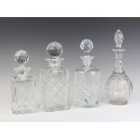 Two cut glass spirit decanters and stoppers, a cylindrical decanter and stopper (possibly wrong