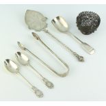 A Victorian silver fiddle pattern caddy spoon, Birmingham 1846, a pair of Edwardian silver teaspoons