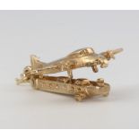 A 9ct yellow gold aeroplane charm 3.3 grams