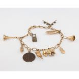 A 9ct yellow gold charm bracelet, gross 9 grams