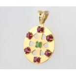 An 18ct yellow gold ruby and emerald pendant, 9.8 grams