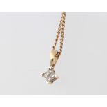 A 9ct yellow gold diamond pendant and chain, 3.6 grams