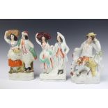 Three 19th Century Staffordshire flatback figures, two farmer and wife 33cm and 31cm and seated