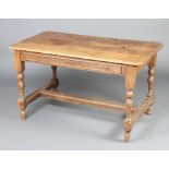 An 18th Century oak side table fitted a frieze drawer, raised on turned and block supports with H