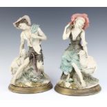 A pair of Capodimonte figures of Shepherd and Shepherdess raised on turned wooden bases 25cm