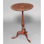 An Edwardian circular inlaid mahogany wine table, raised on a pillar and tripod base 69cm h x 43cm