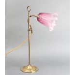 An Edwardian brass adjustable table lamp with pink glass shade 50cm
