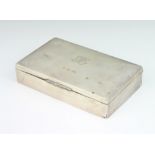 A rectangular silver cigarette box with presentation inscription, Birmingham 1915 14cm There are