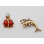 A 9ct yellow gold ladybird charm and a ditto dolphin charm 1.2 grams