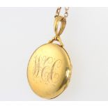 A 9ct yellow gold locket and chain 10.4 grams