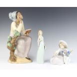 A matt Lladro figure of a seated girl reading a book impressed A9J 32cm, Lladro standing lady in