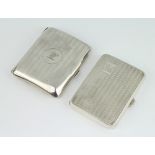 A silver engine turned cigarette case and 1 other, gross 148 grams