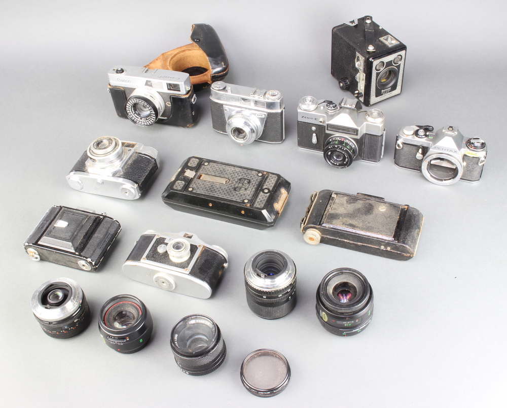 A Retinette 1A camera, a Pentax ME camera, a Halina 6-4 camera, Zenith-E, a Finetta camera, Canon