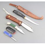 A Victorinox pocket knife, a Swedish EKA folding knife with wooden grip, a Puma Ranbule 455