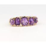 A 9ct yellow gold 5 stone amethyst ring, 4.6 grams, size M