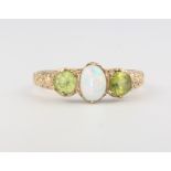 A 9ct yellow gold opal and peridot ring size N, 2.2 grams