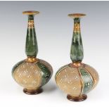 A pair of Royal Doulton blue and brown glazed club shaped vases, the base impressed Royal Doulton