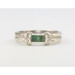 A 9ct white gold emerald and diamond ring, size N, 3.6 grams