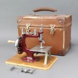 An Essex miniature sewing machine complete with carrying case