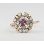 A 9ct yellow gold ruby and diamond cluster ring size K, 2 grams