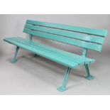 A cast iron and green painted wooden slatted garden bench, base marked BSG8 75cm h x 269cm w x