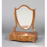 A 19th Century mahogany bevelled plate shield shaped dressing table mirror contained in a mahogany